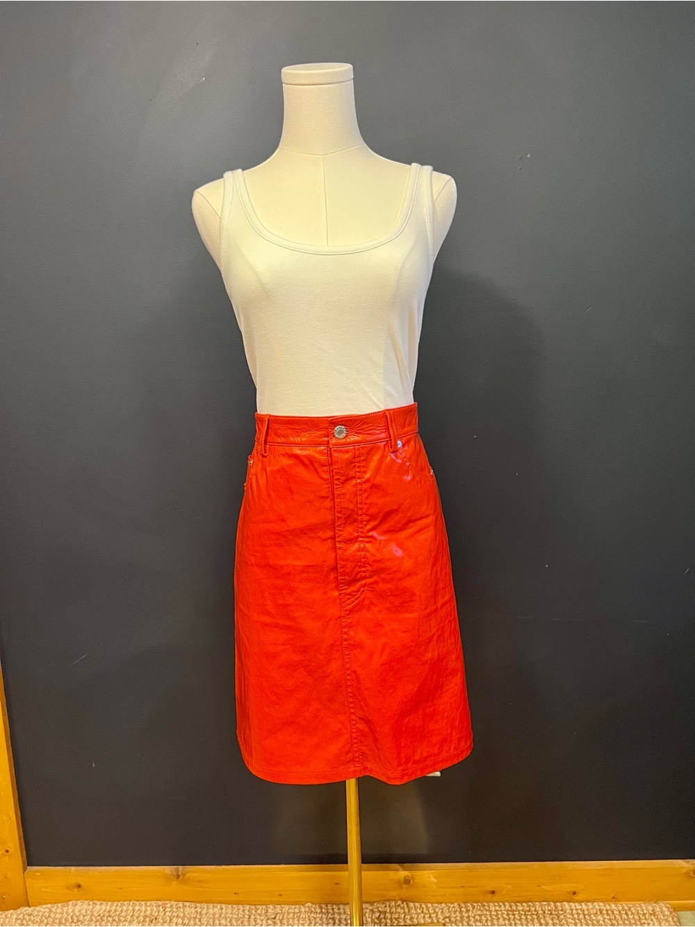 HELMUT LANG Orange patent leather skirt with 5 pockets.
